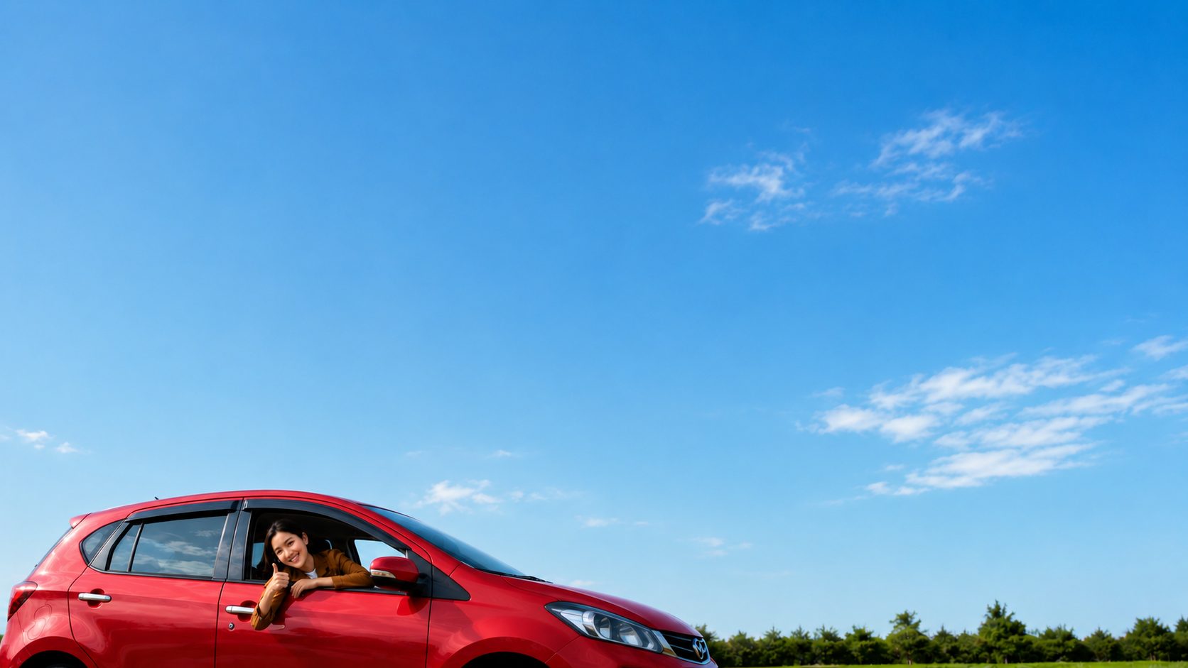 CARGURU services with a red car under a blue sky